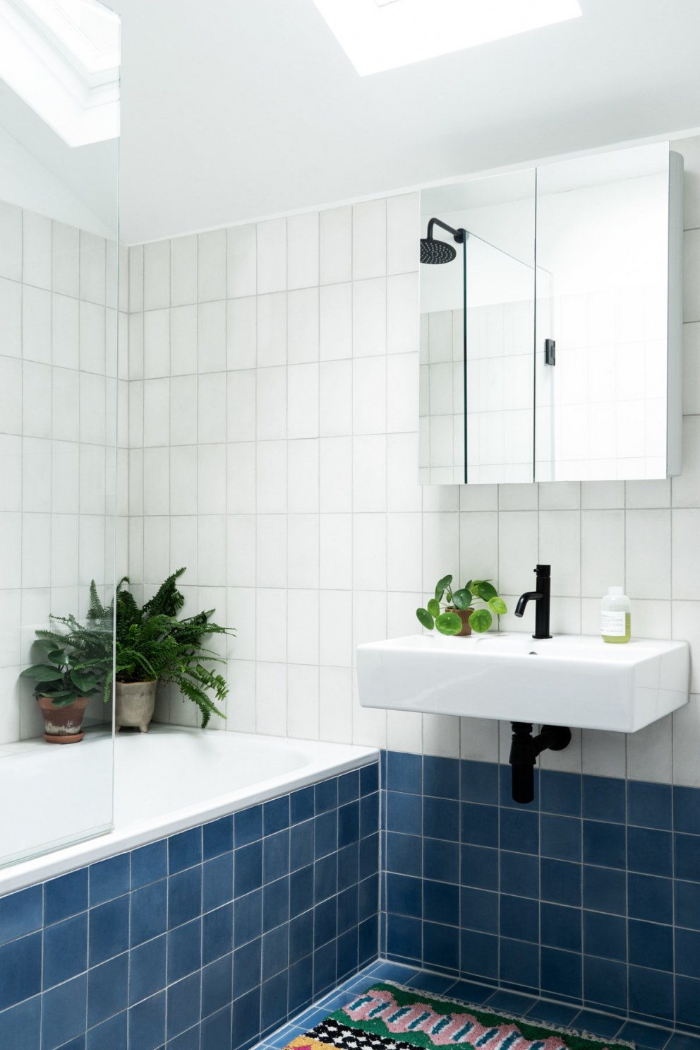 Peckham Home | Blue, black & white bathroom | Interior Designers